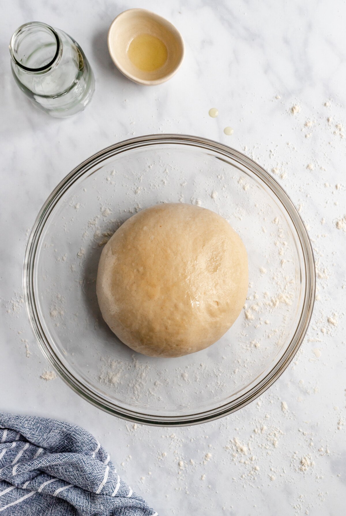 pizza dough in a bowl rising birds eye view