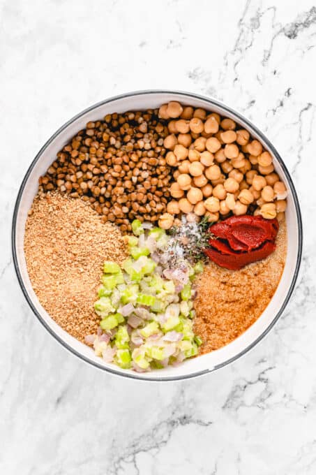 Ingredients for vegan meatloaf combined in a large bowl.