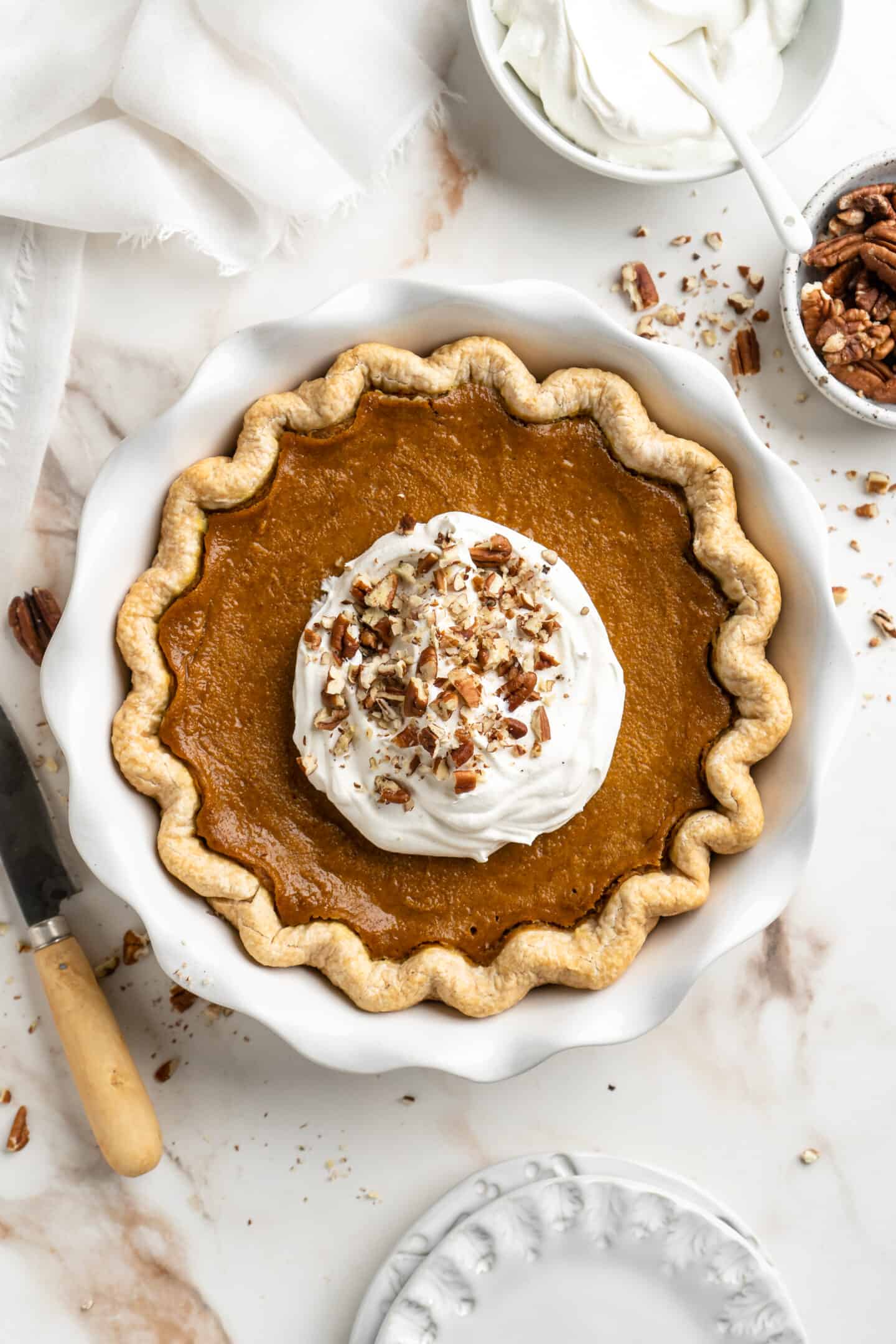 fully baked pie crust with whipped coconut cream on top.