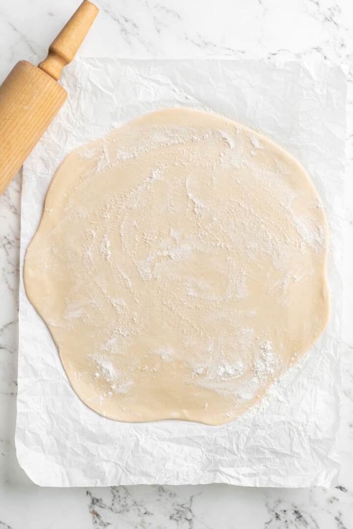 pie dough rolled out to a thin circle.