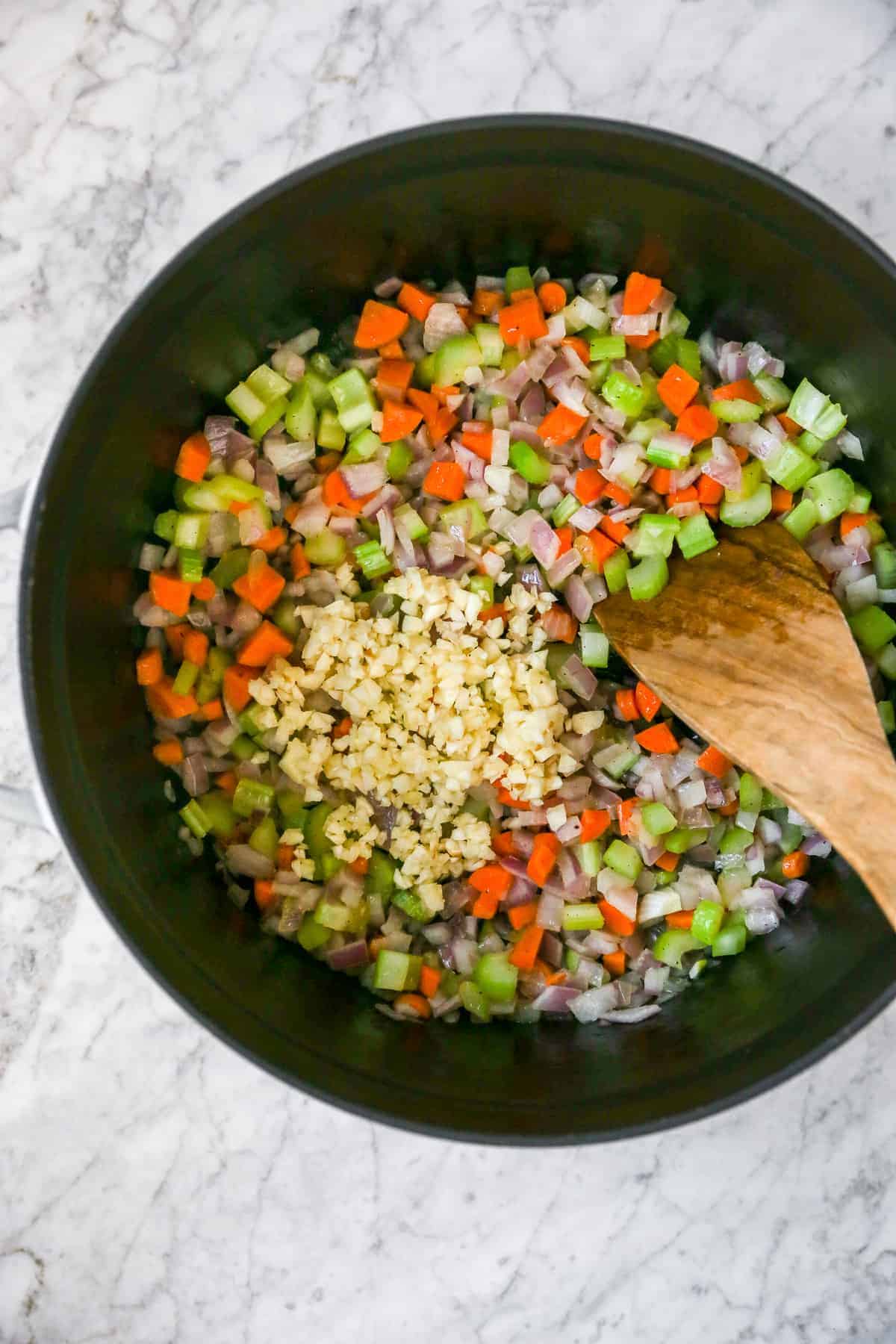 sautéing the mirepoix and adding in garlic