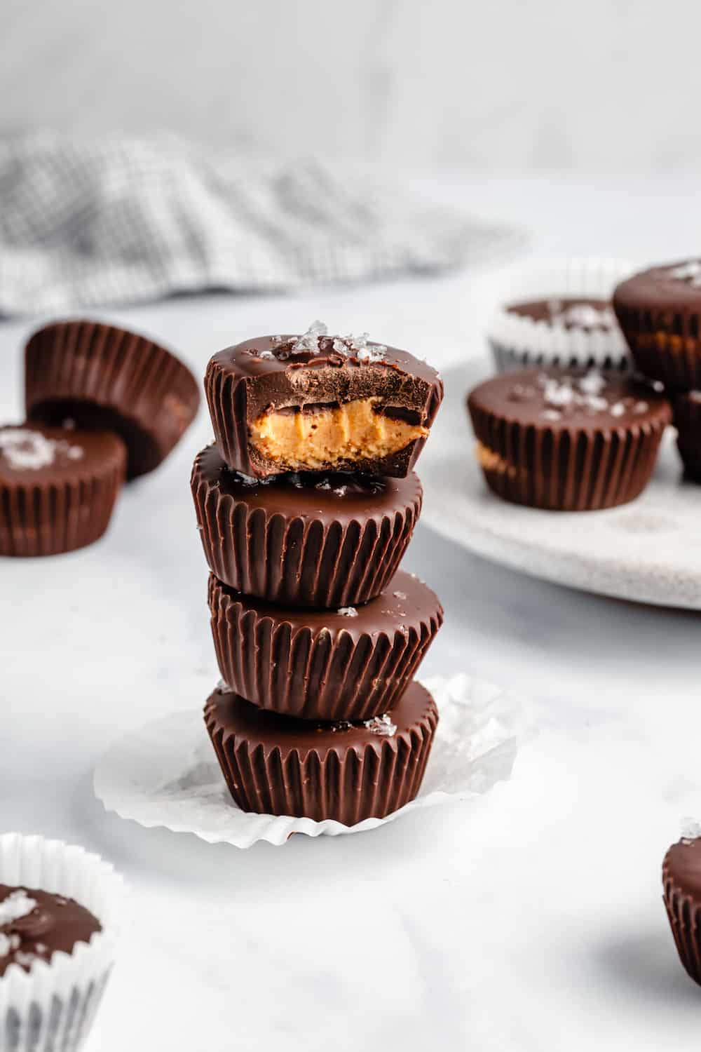 A Stack of Four Peanut Butter Cups, with a Bite Taken From the Top One