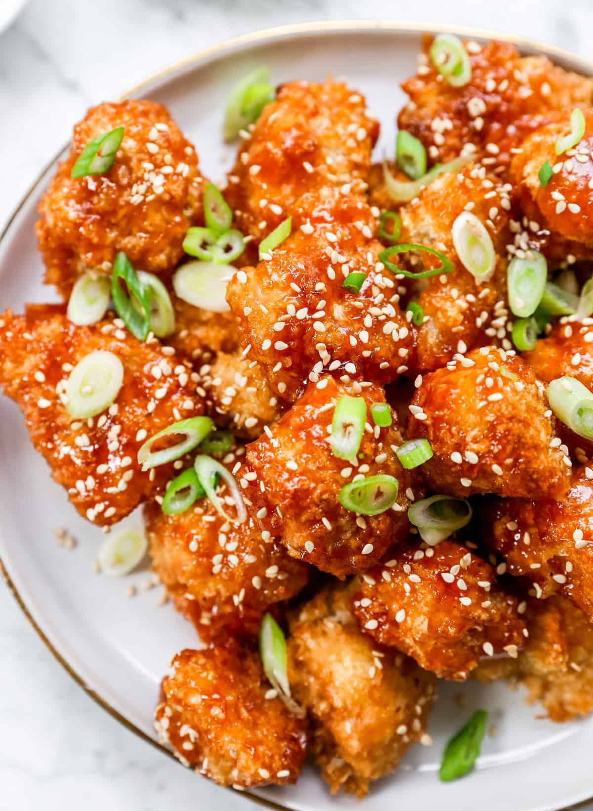 Close up shot of Sweet and sour cauliflower wings on a white plate