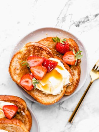 Vegan french toast with sliced strawberries.