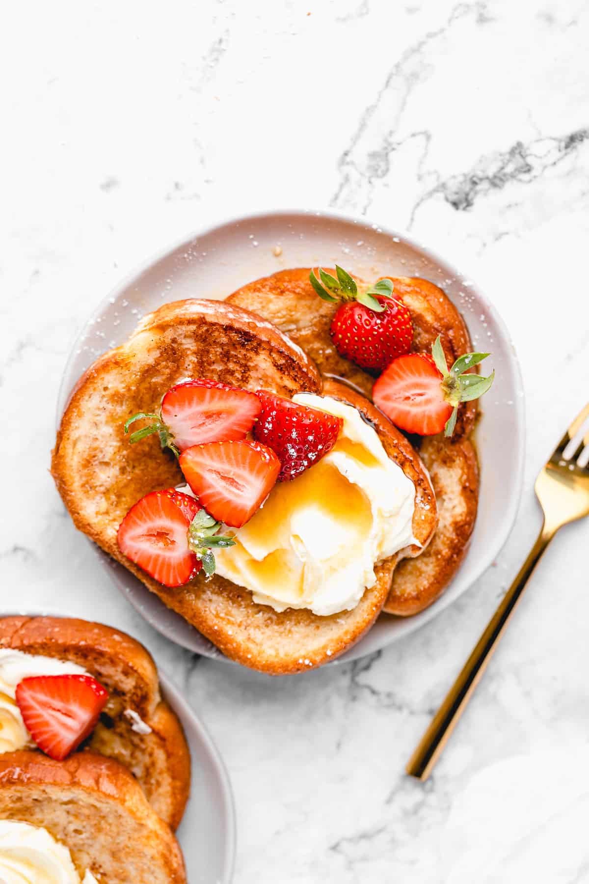 Vegan french toast with sliced strawberries.