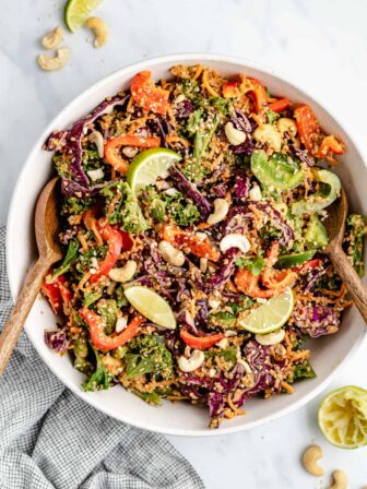 cashew Thai quinoa salad in a bowl with salad servers