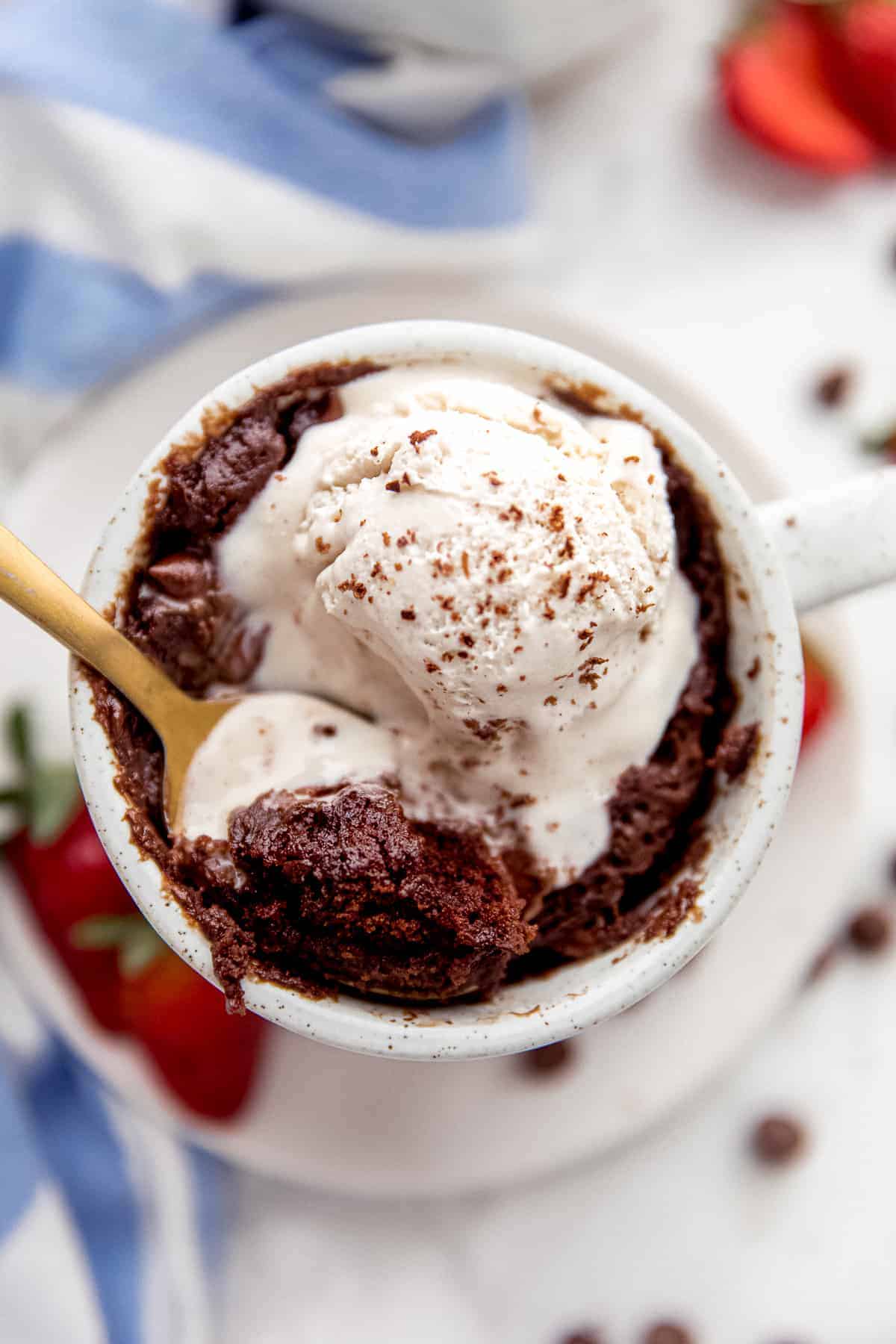 Vanilla ice cream and brownie in a mug.