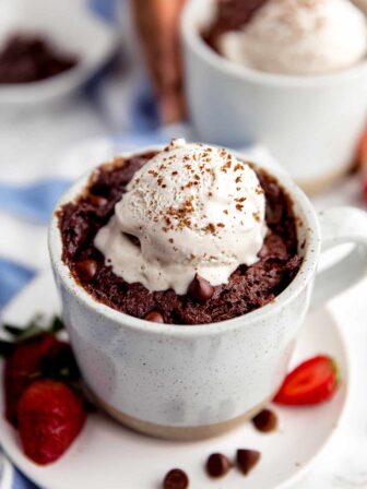 Fudgy mug brownie with vanilla ice cream.