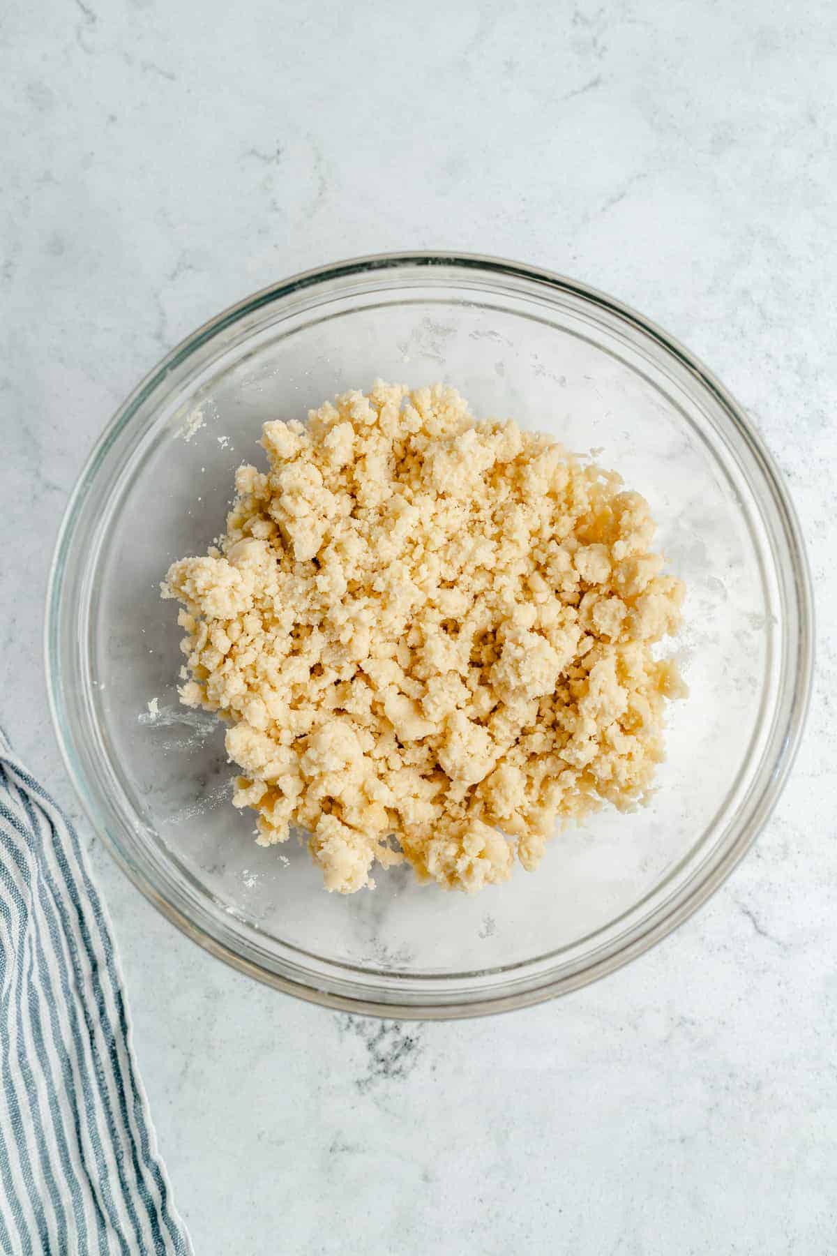 Mixed shortbread crust in a bowl.
