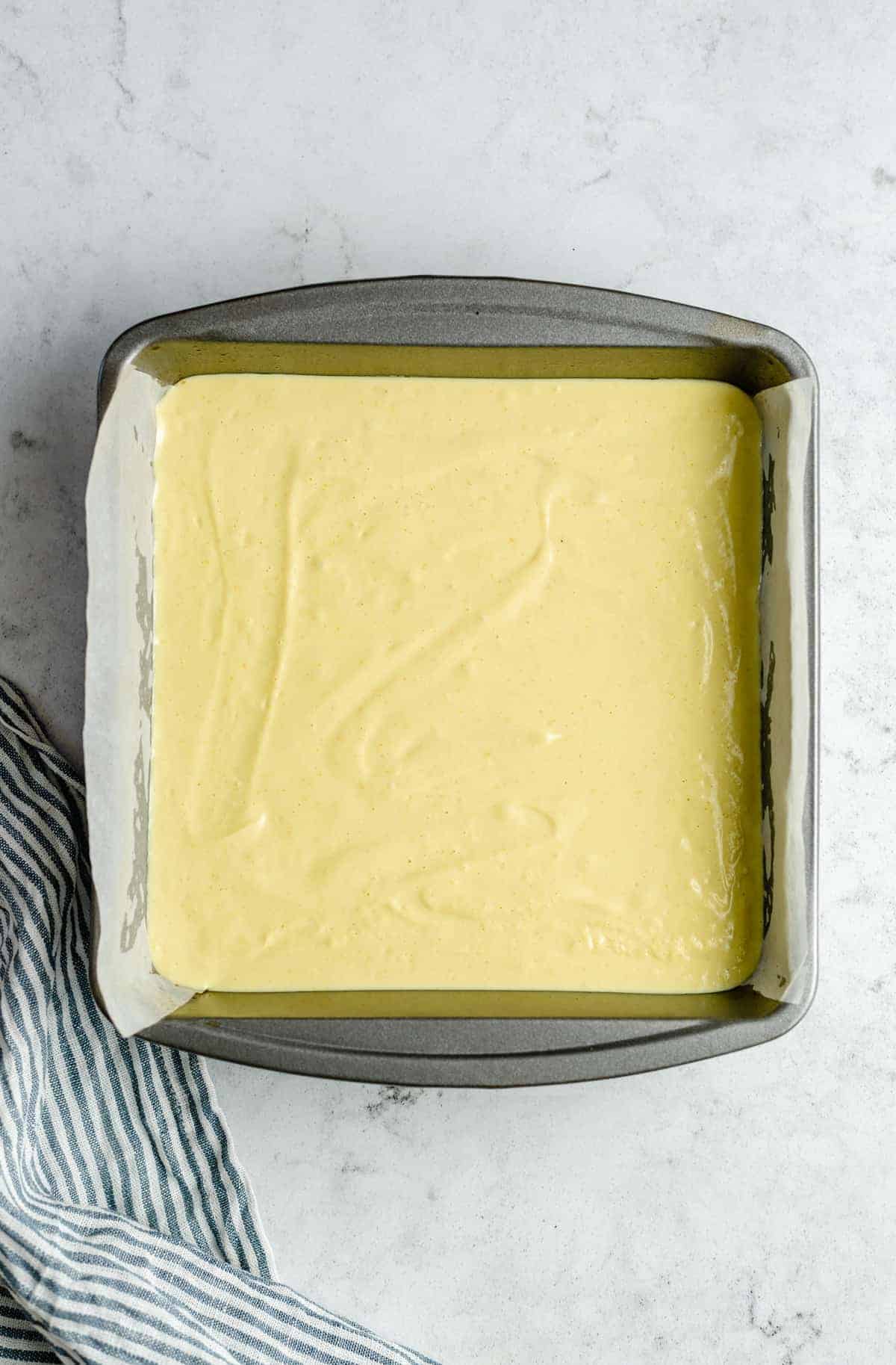 Unbaked lemon bars in a pan.