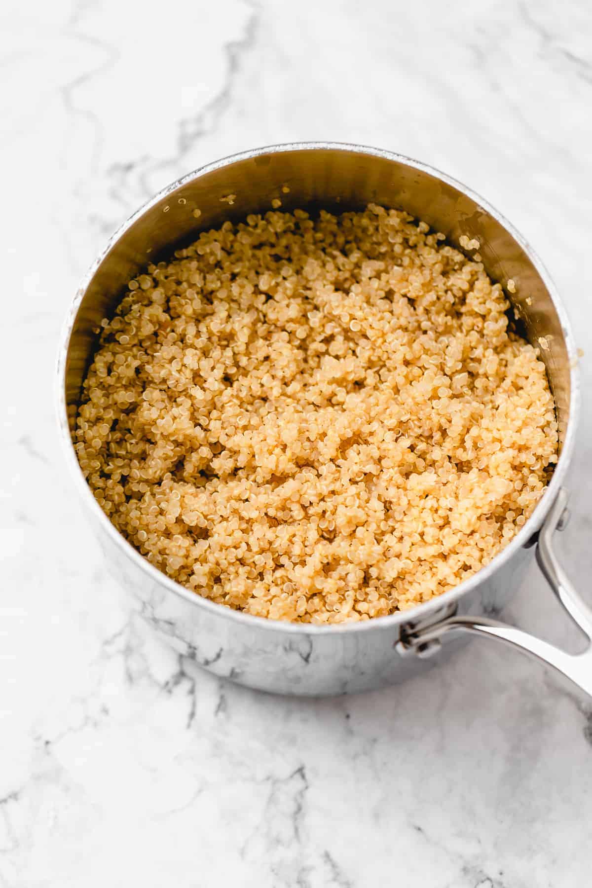 cooked quinoa in a silver saucepan