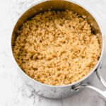 cooked quinoa in a silver saucepan
