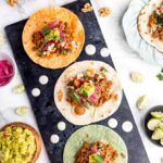 Three vegan tacos on a platter.