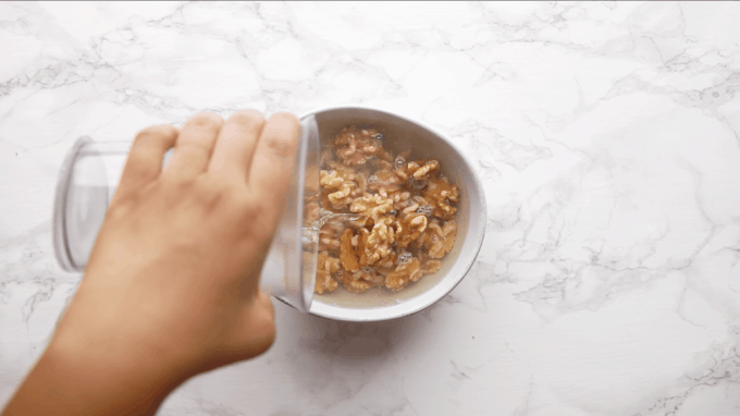 Walnuts with water in a bowl.