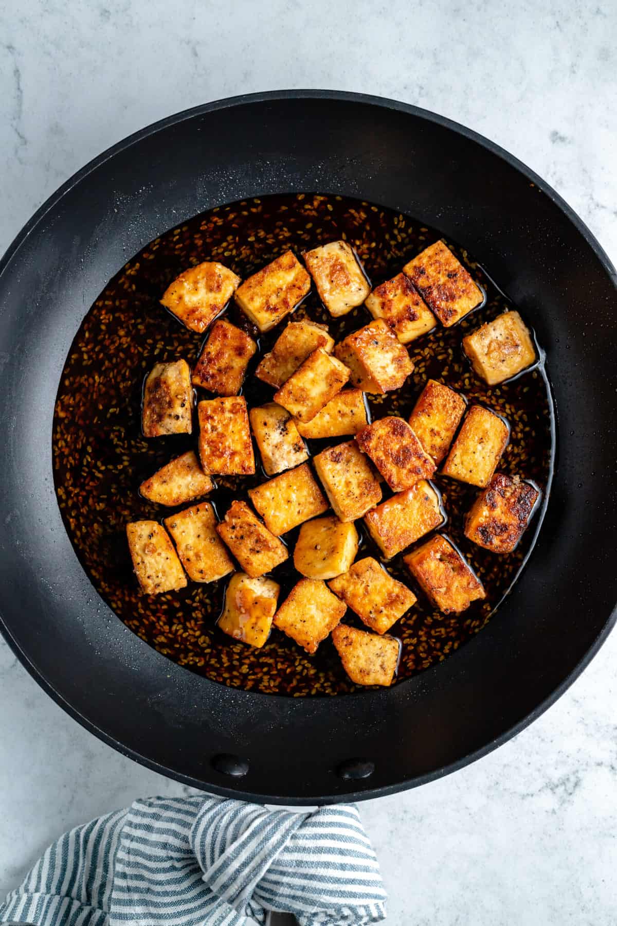 Crispy tofu cubes in teriyaki sauce.