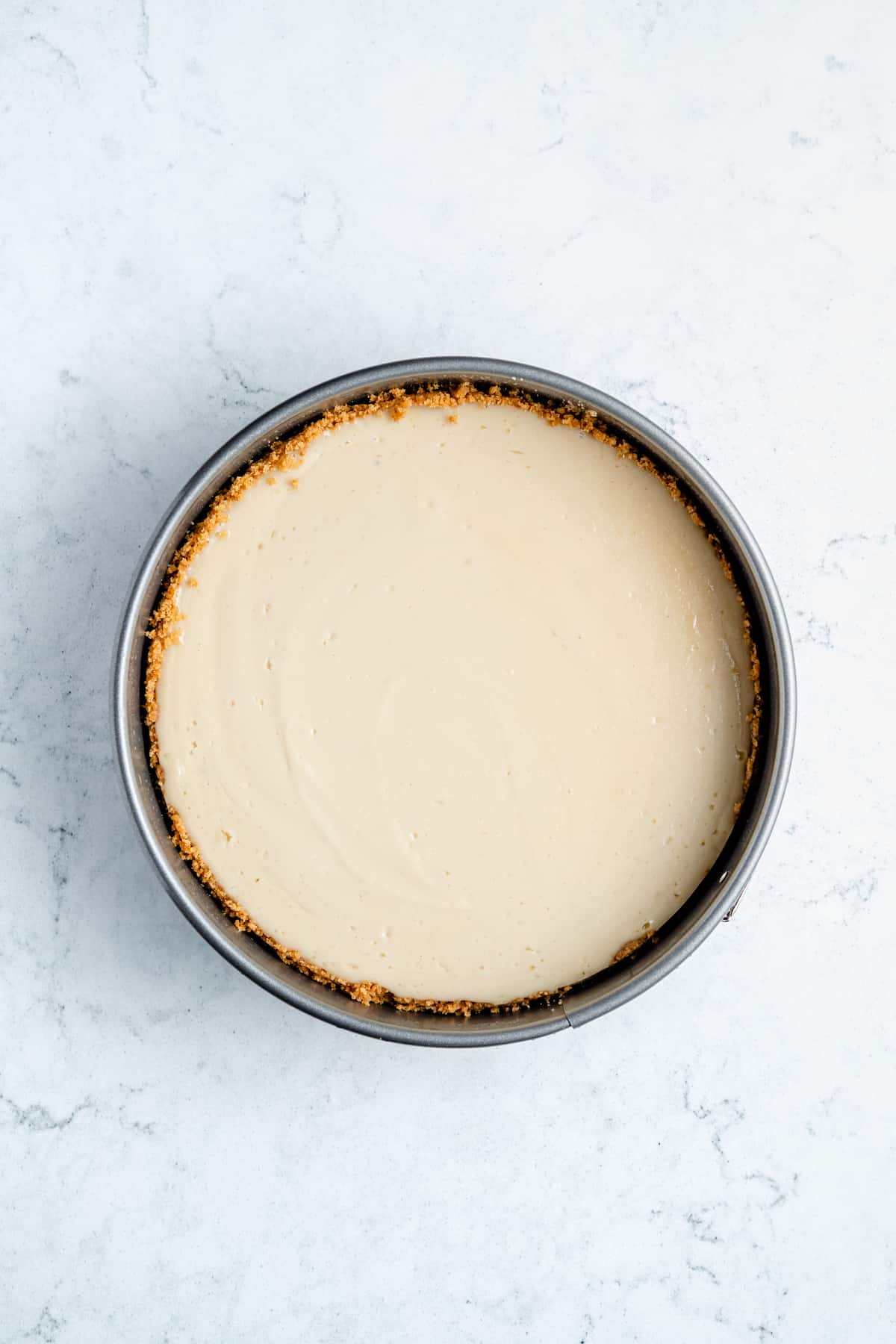 Baked vanilla cheesecake with graham cracker crust.