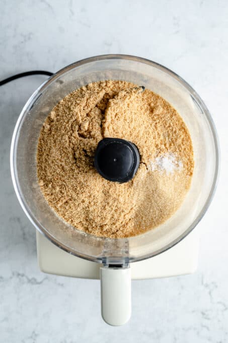 Graham cracker crumbs and brown sugar in a food processor.