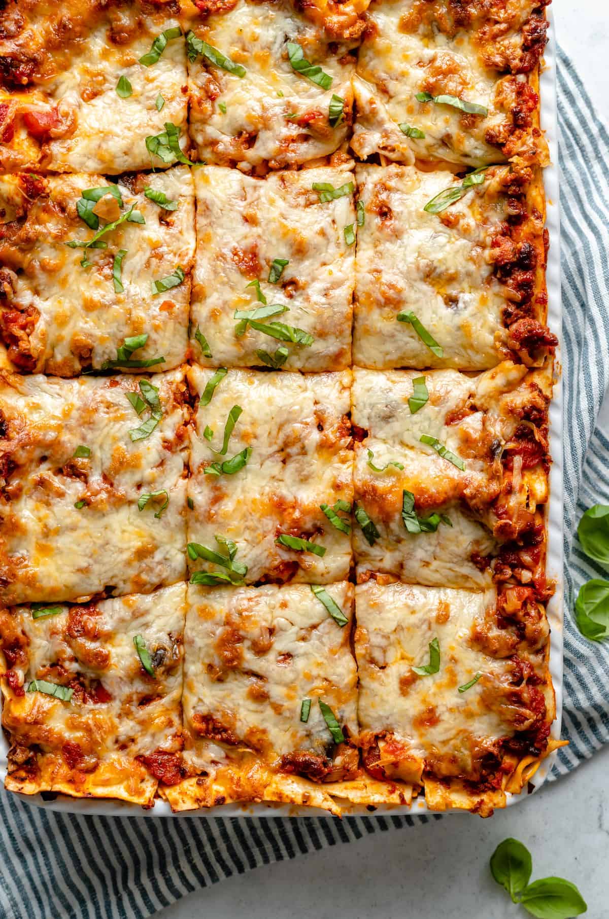 Vegan lasagna cut into squares.