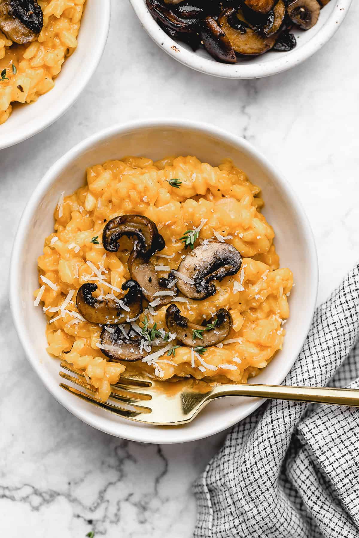 Vegan risotto in a bowl with mushrooms.