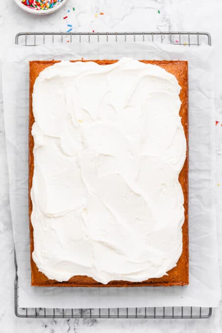 Vanilla buttercream on top of a vanilla cake.