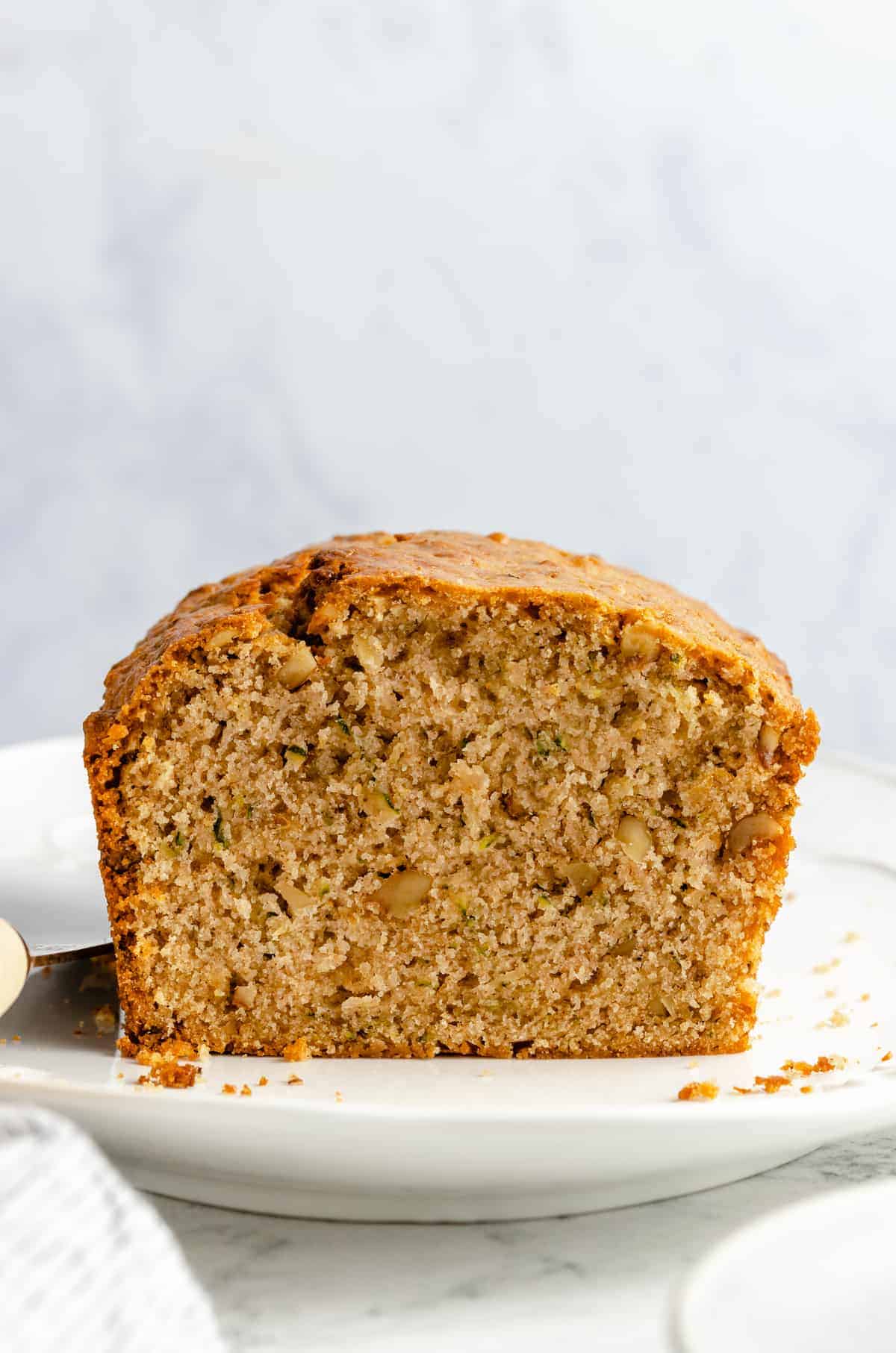Loaf of bread with grated zucchini and walnuts.
