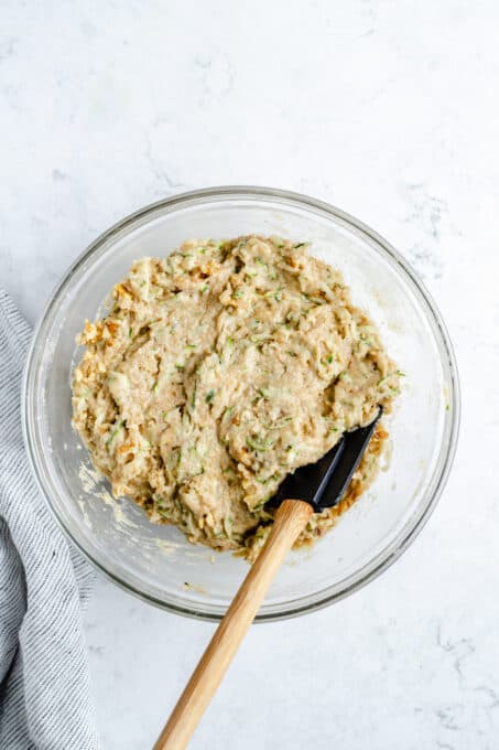 Mixed zucchini bread batter in a bowl.