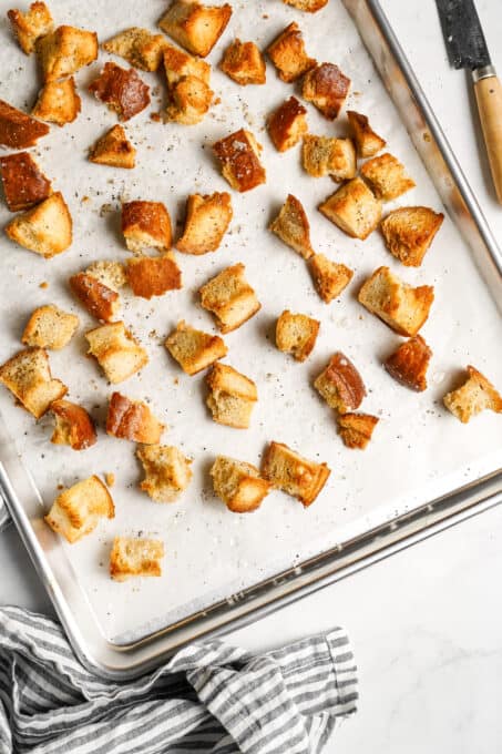 Oven-baked croutons on a baking sheet.