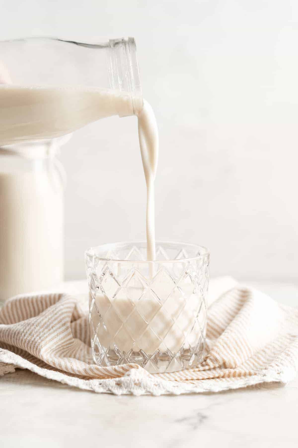 Pouring soy milk into a glass