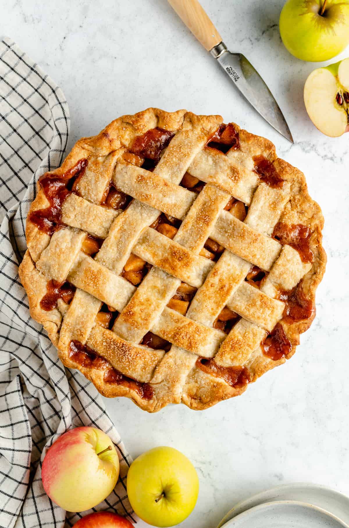 Baked vegan apple pie with a lattice over the top.