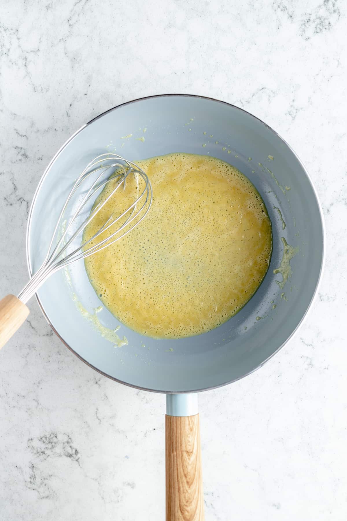 Overhead shot of roux in saucepan with whisk