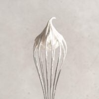 Whisk with whipped coconut cream on end