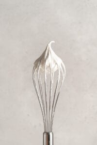 Whisk with whipped coconut cream on end
