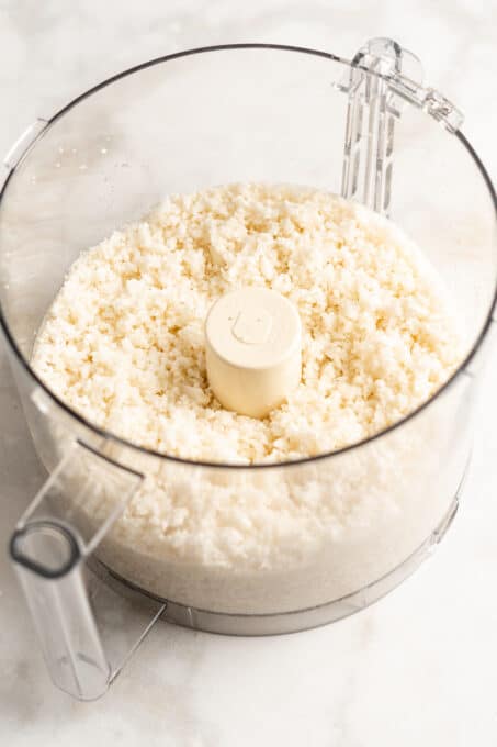 Riced cauliflower inside food processor container