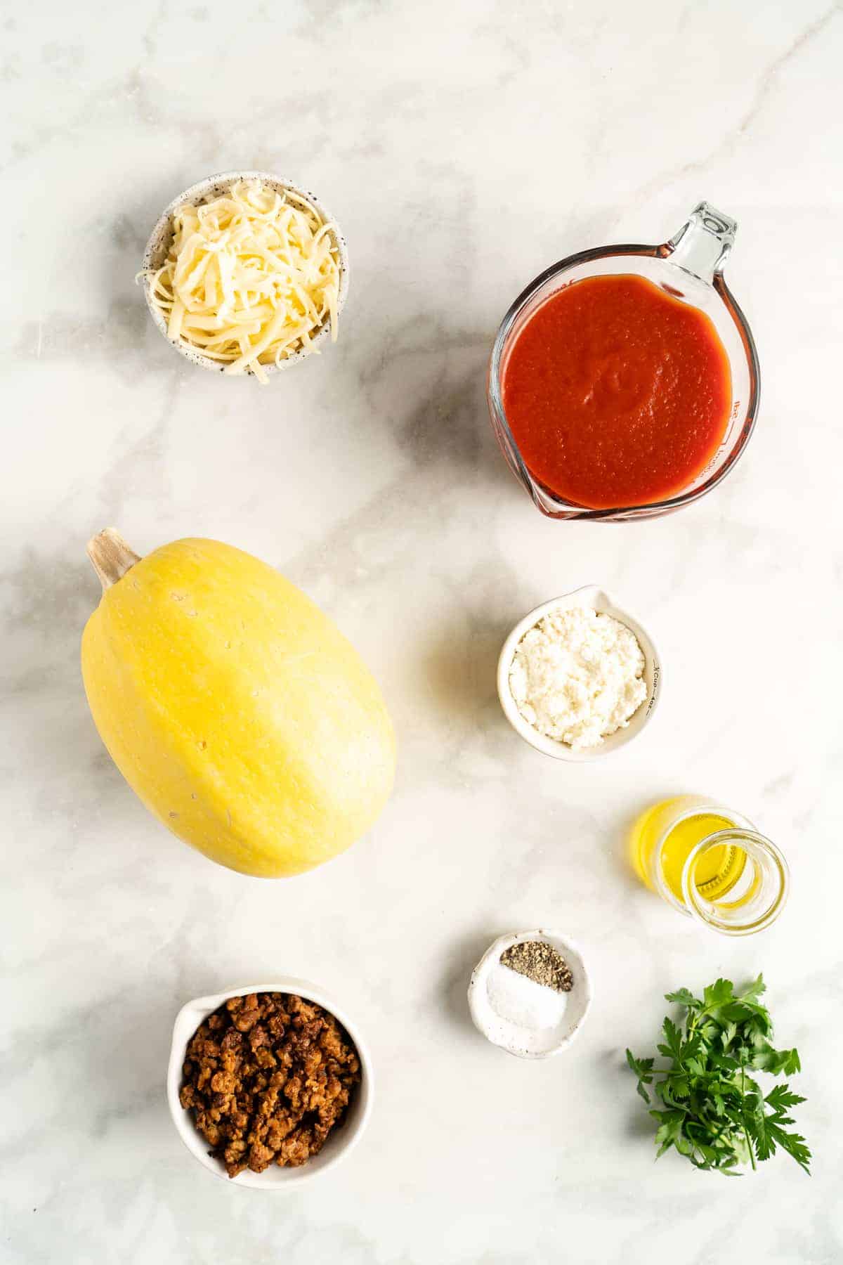 Overhead view of spaghetti squash lasagna boat ingredients