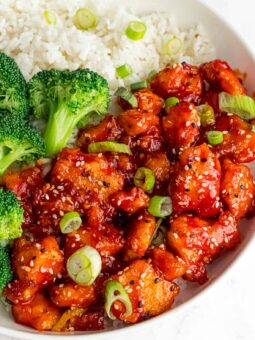 korean tofu bites on a bed of rice with broccoli