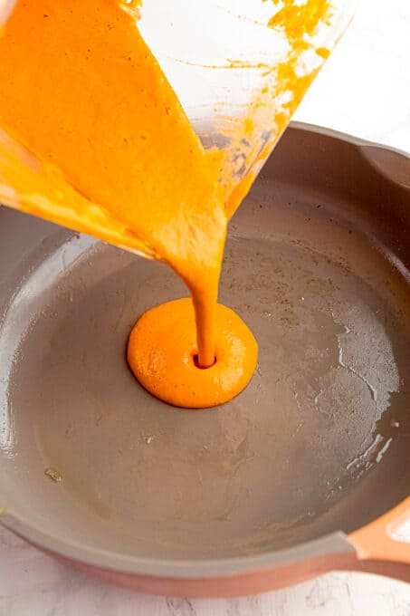 sauce pouring into pan