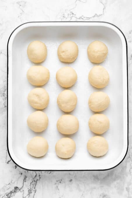 dough balls lined up before rising