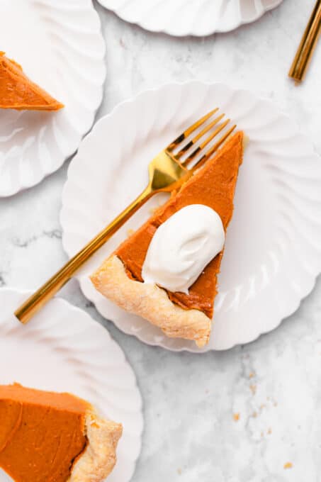 sweet potato pie slices on plates with a gold fork