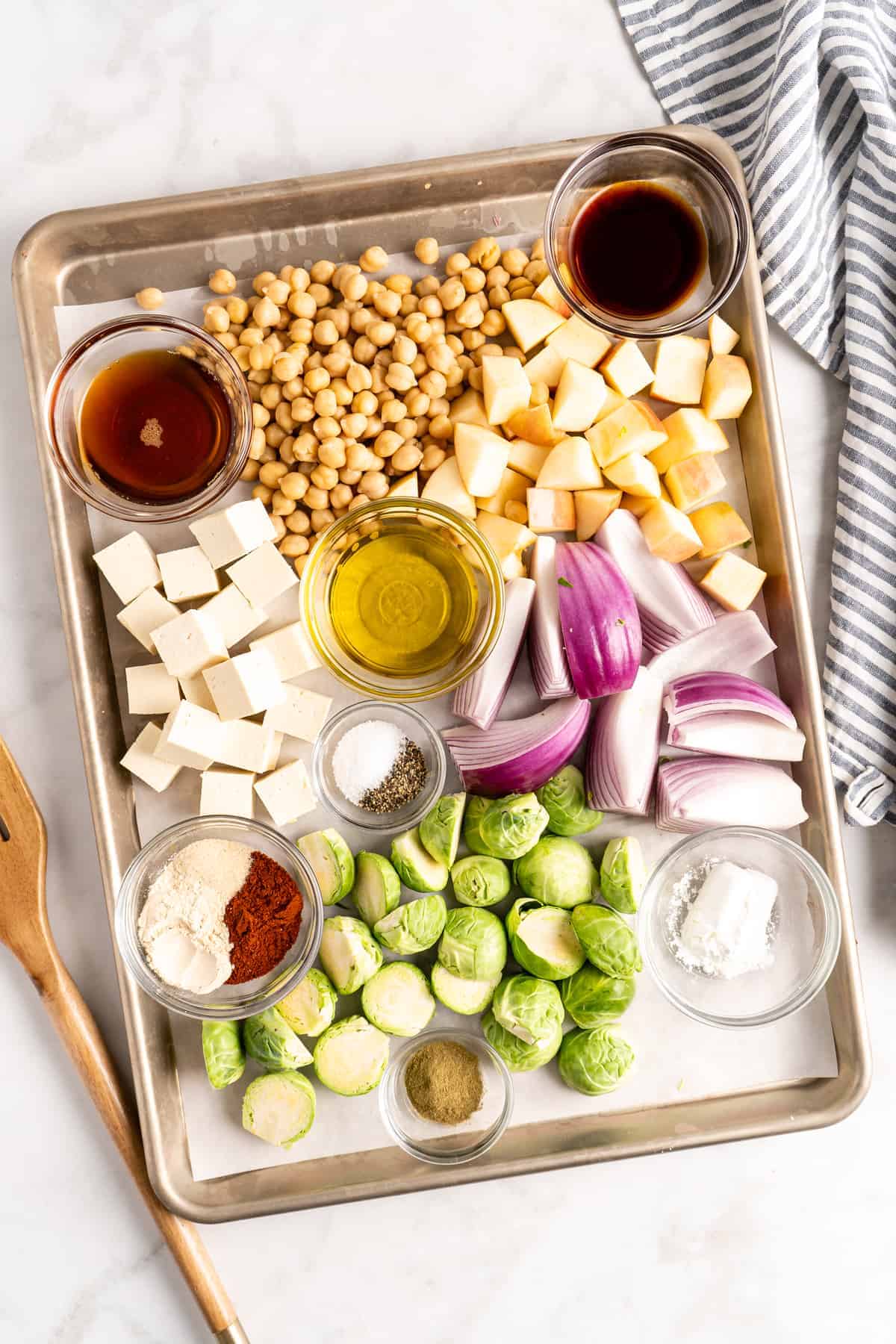 Overhead view of vegan Buddha bowl ingredients on a sheet pan.