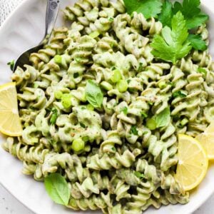 green goddess pasta in a bowl with a spoon in it