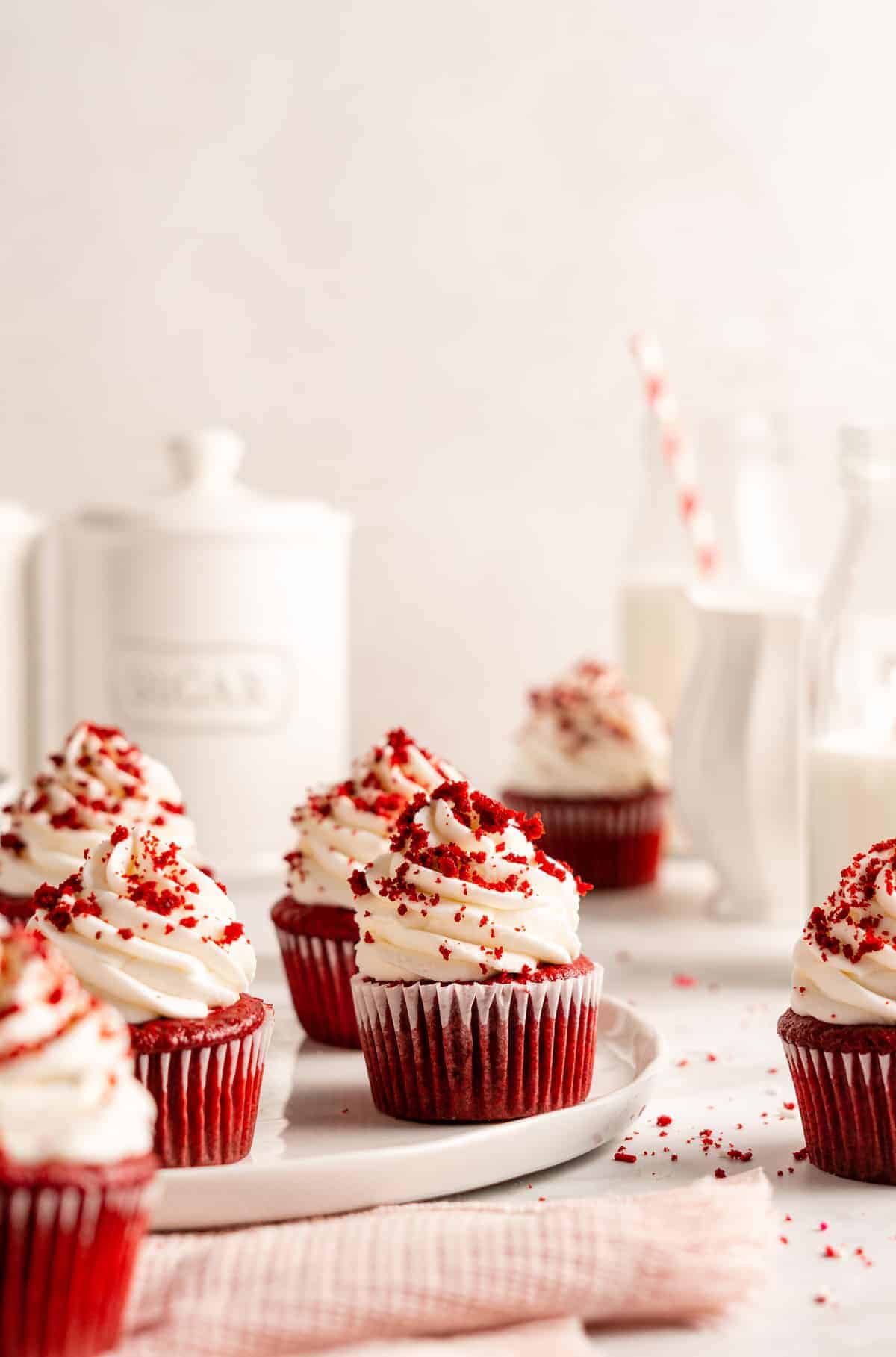 Vegan red velvet cupcakes with cream cheese frosting and cake crumbs