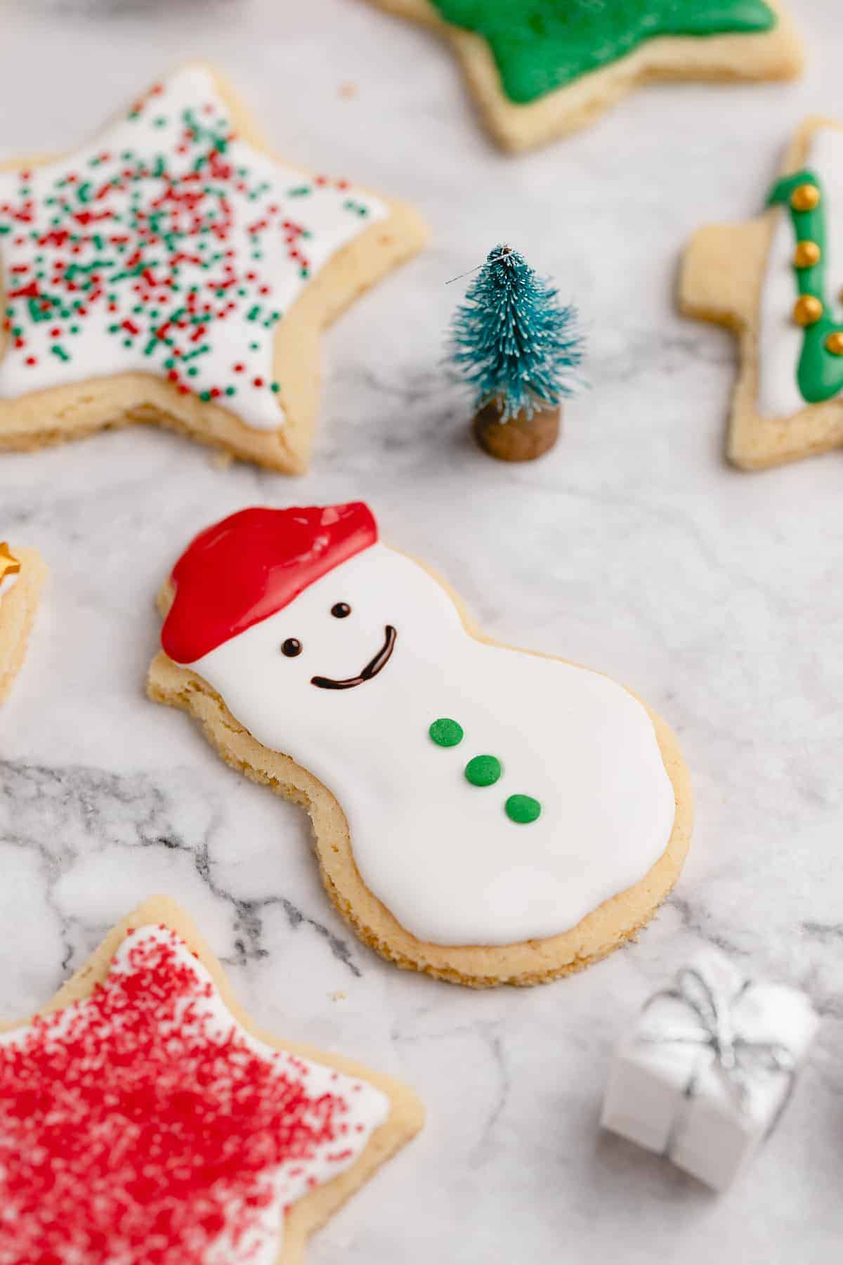 Closeup of decorated snowman sugar cookie