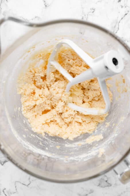 Overhead view of sugar cookie dough in stand mixer bowl