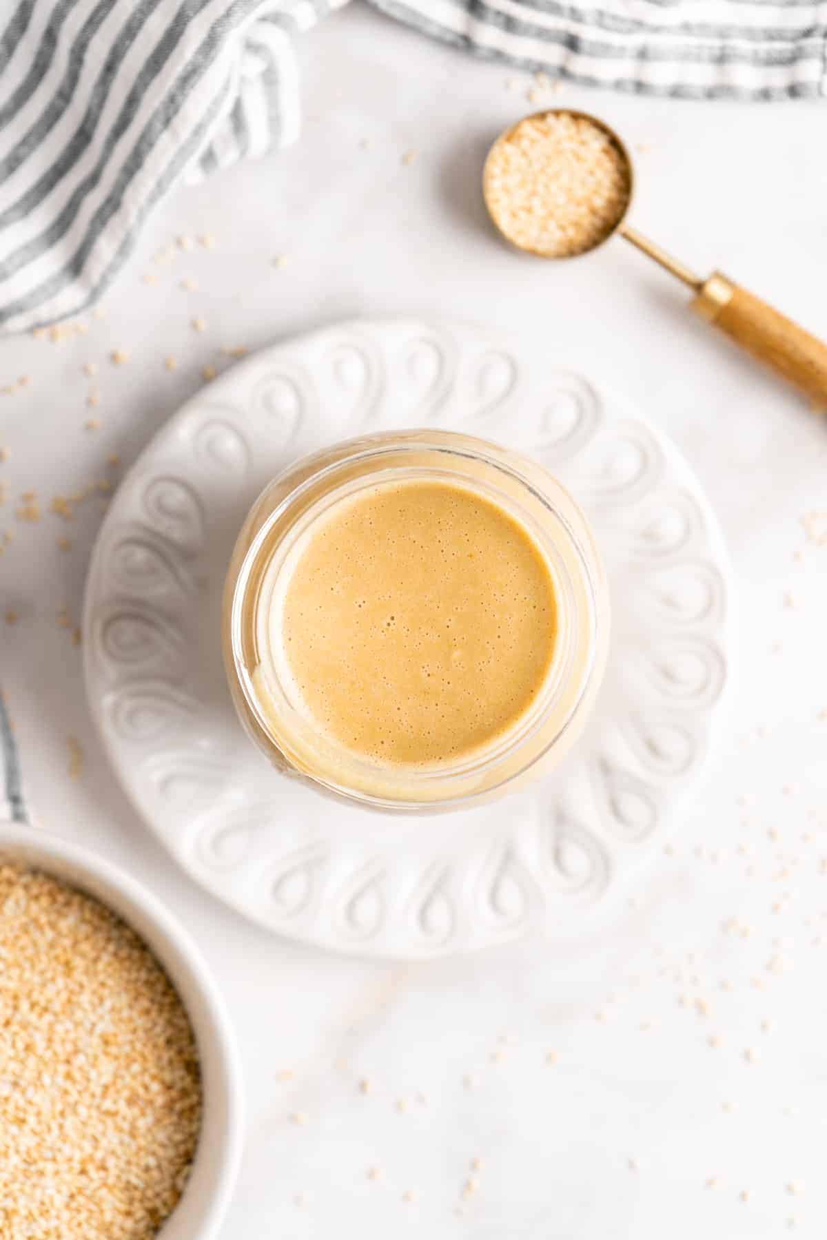 Overhead view of tahini in jar