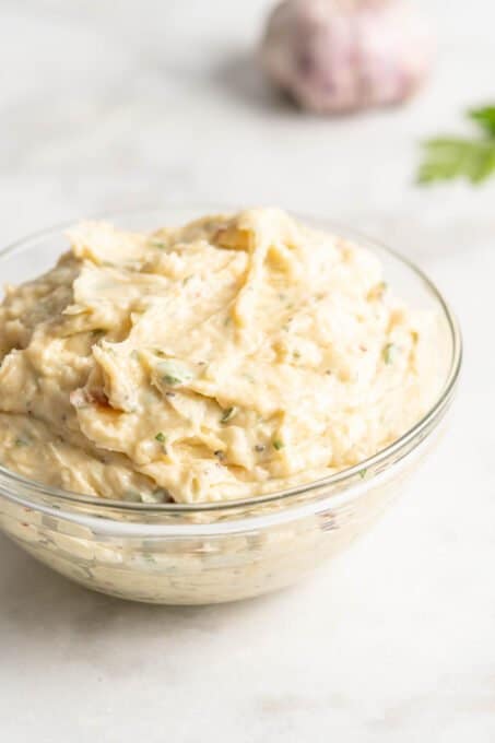 Glass bowl filled with garlic butter