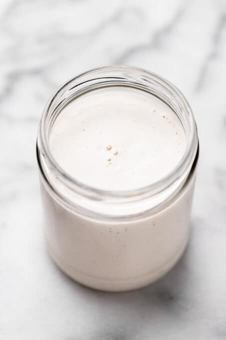Overhead view of vegan heavy cream in jar