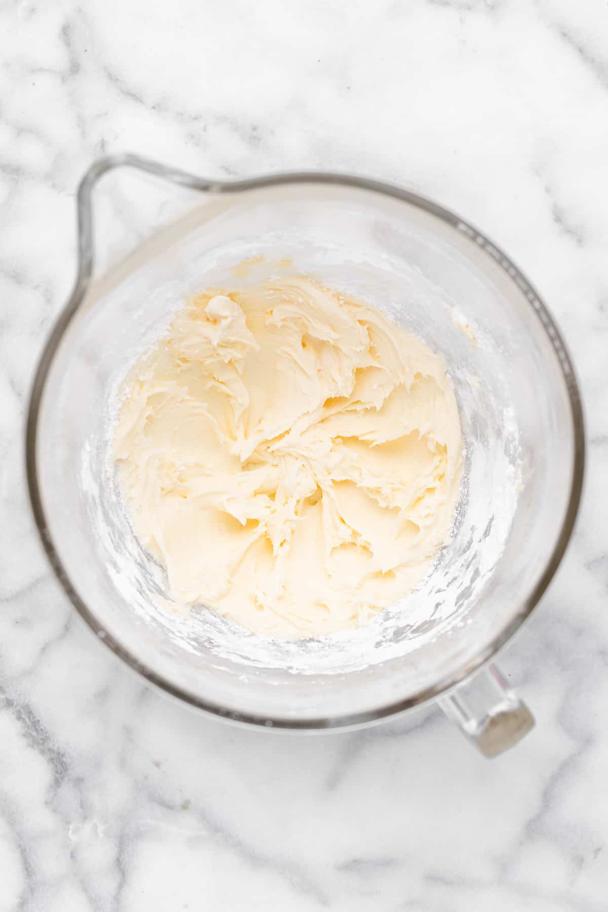 Sugar and butter creamed in mixing bowl