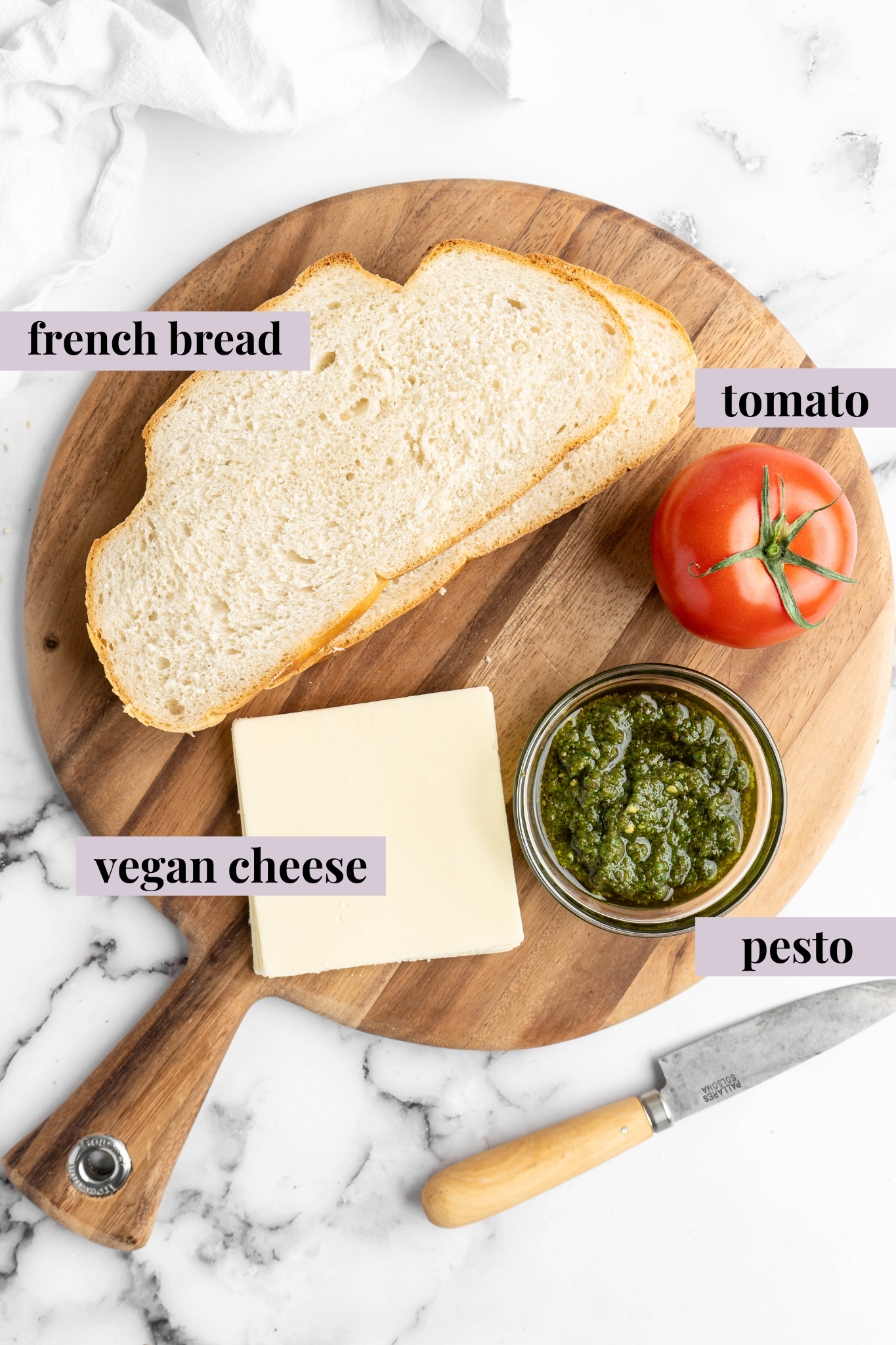 Overhead view of vegan caprese sandwich ingredients with labels