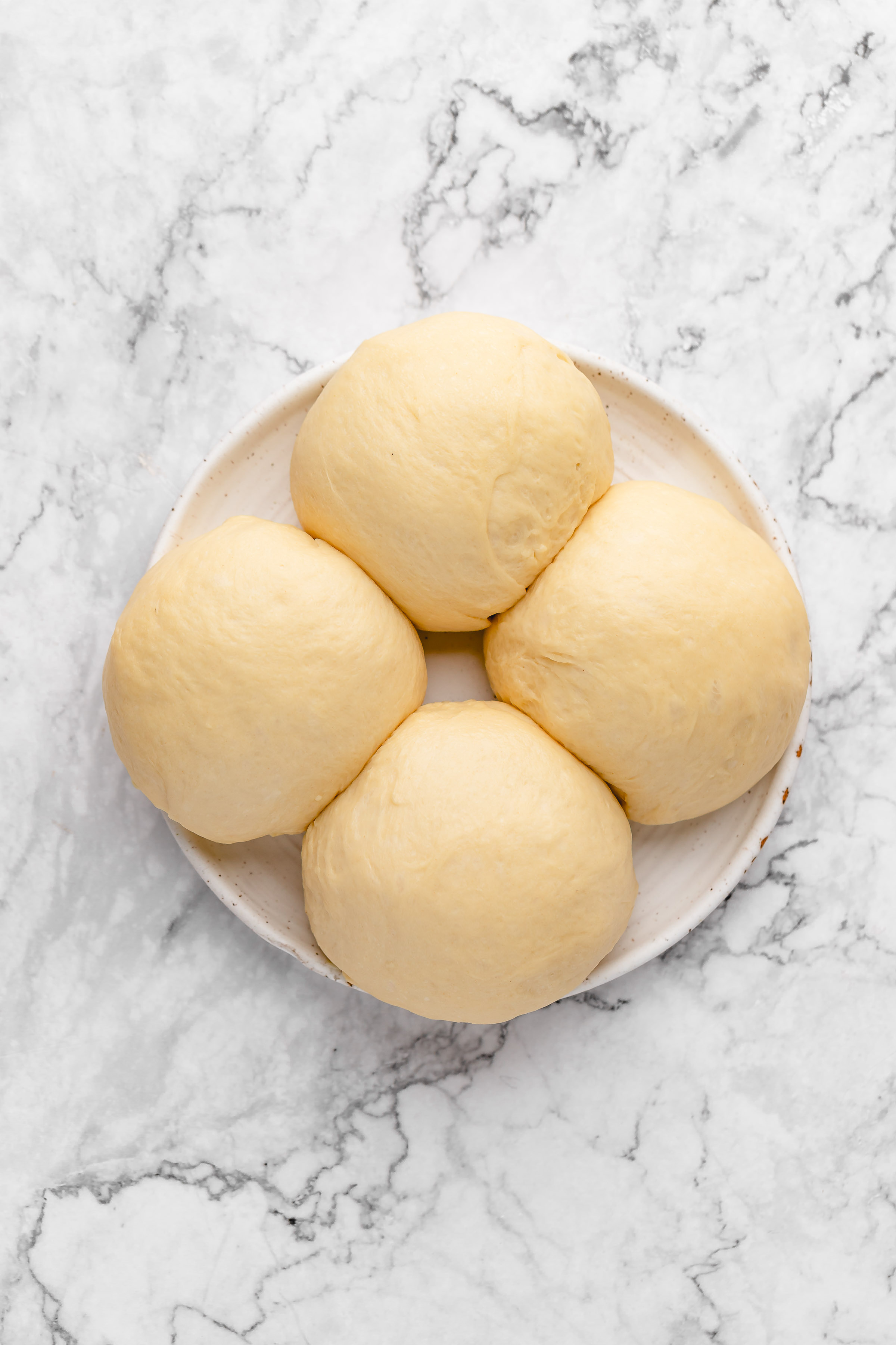 Four balls of bread dough