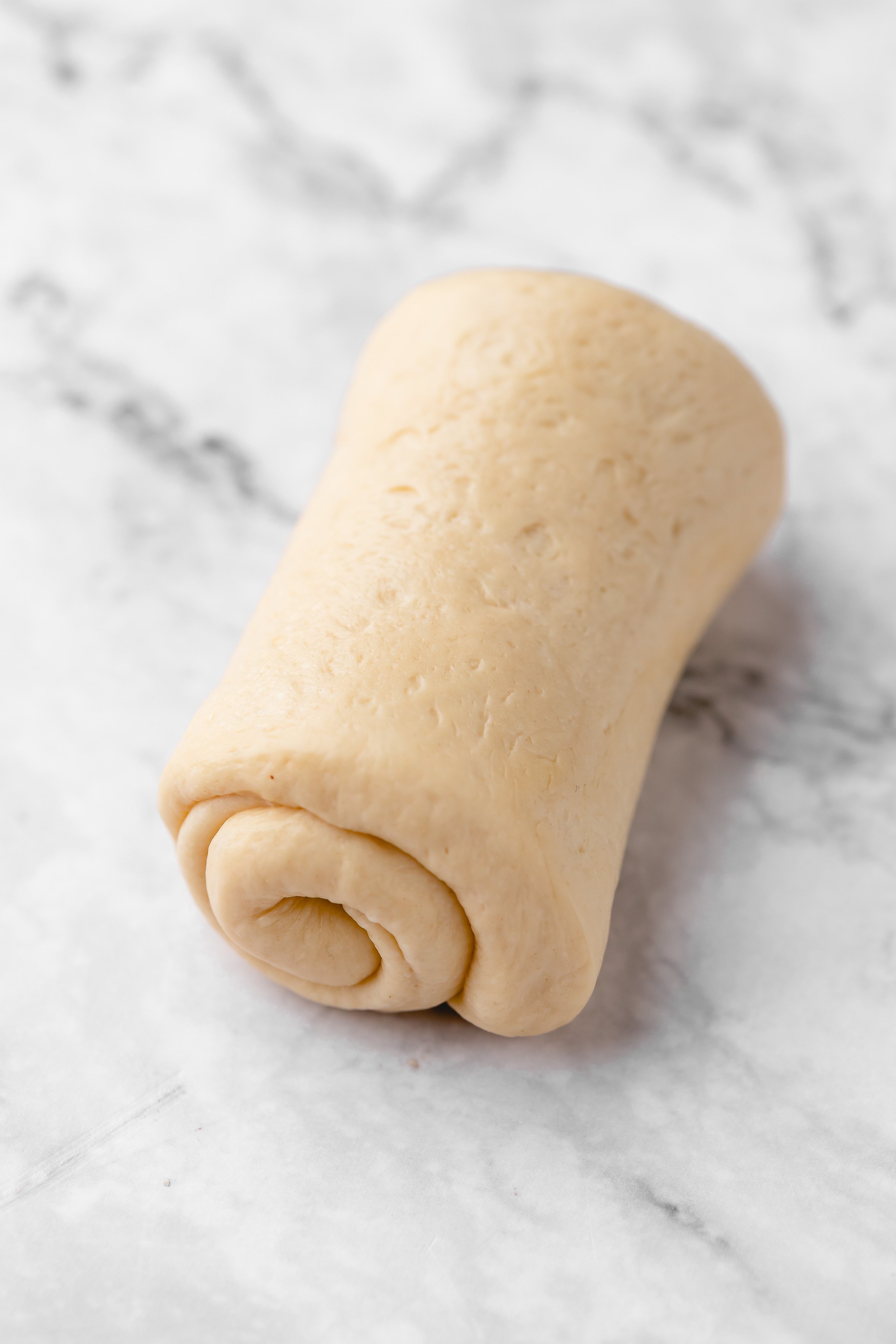 Roll of milk bread dough